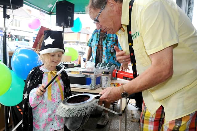 Lola Holdaway (5) from Horndean, takes part in the magic show with Just Alex. Picture: Sarah Standing