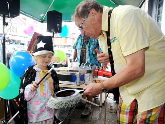 Lola Holdaway (5) from Horndean, takes part in the magic show with Just Alex. Picture: Sarah Standing