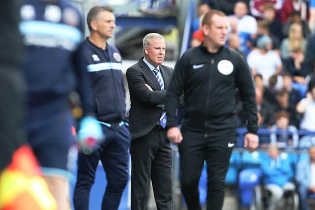 Pompey boss Kenny Jackett, centre, today as his team drew with Shrewsbury. Picture: Joe Pepler