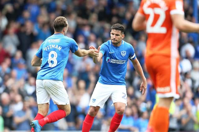 Brett Pitman, left, celebrates his penalty with Gareth Evans. Picture: Joe Pepler