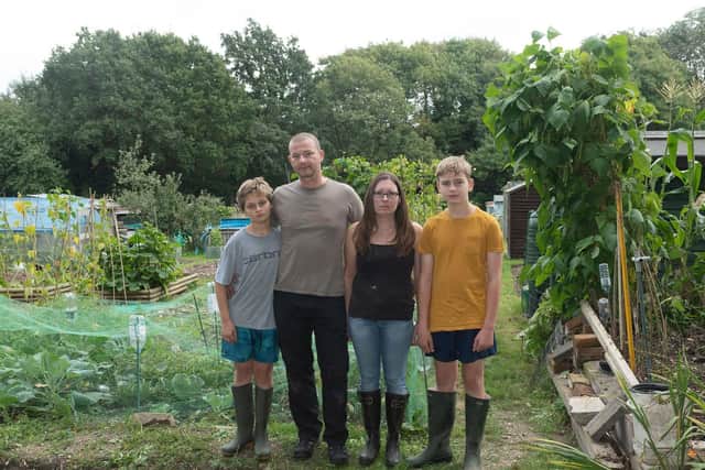 Petition organiser Simon Hitchcock with Joshua Crisp and Louise and Thomas Hitchcock at their allotment in The Gillies
Picture by Keith Woodland