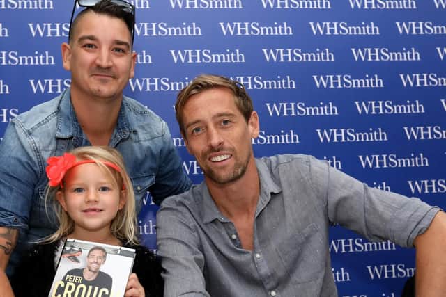 BIG MOMENT: Anthony Marshman and his daughter, Evie, 6, meet Peter. Former Pompey player Peter Crouch ' at WH Smith, Commercial Road, Portsmouth
Pictures: Chris Moorhouse