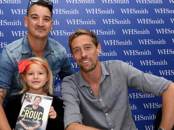 BIG MOMENT: Anthony Marshman and his daughter, Evie, 6, meet Peter. Former Pompey player Peter Crouch ' at WH Smith, Commercial Road, Portsmouth
Pictures: Chris Moorhouse