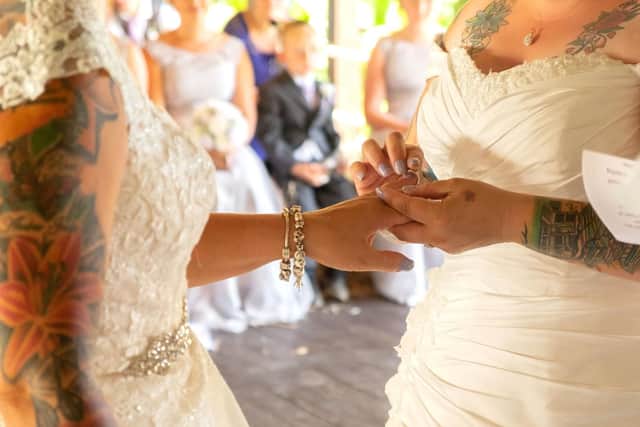 The happy couple exchange rings.