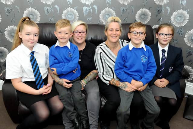 Mandy (35) and Kerry Sterland (45) from Cosham, got married earlier this year and both their first time in a same sex relationship. Pictured is: (third left) Mandy Sterland (35) with her children Kira McKeown (12), Kian McKeown (6), wife Kerry Sterland (45) and Kerry's children Riley Sterland-Carter (8) and Summer Sterland-Carter (11).