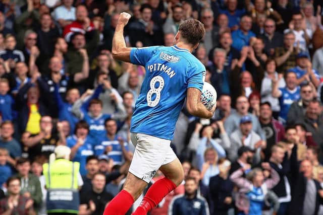 Brett Pitman celebrates after preserving Pompey's unbeaten league start.  Picture: Joe Pepler