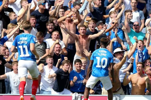 Jamal Lowe celebrates in front of the Pompey fans