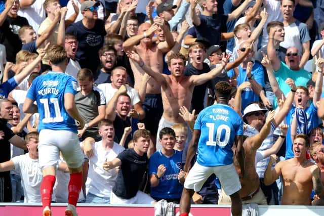 Jamal Lowe celebrates in front of the Pompey fans