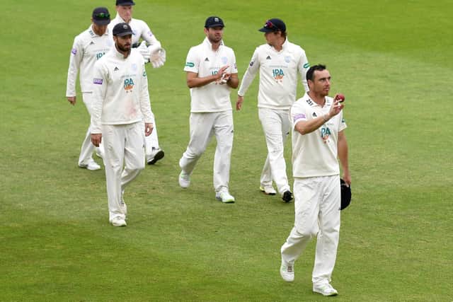 Kyle Abbott leads Hampshire off. Picture: Neil Marshall