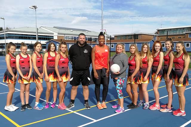 Eboni Beckford-Chambers, Helen Keet and personal trainer Rob Baldwin with members of the All About Netball League