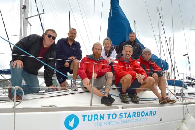 The Turn To Starboard crew on board their vessel in Haslar Marina, Gosport. Picture: David George