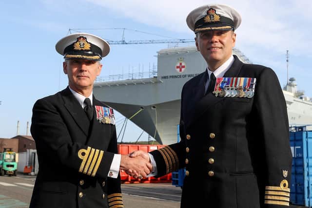 HMS Prince of Wales's new commanding officer, Captain Stephen Moorhouse, right, with the ship's former senior naval officer, Captain Ian Groom, left.
Photo: Royal Navy