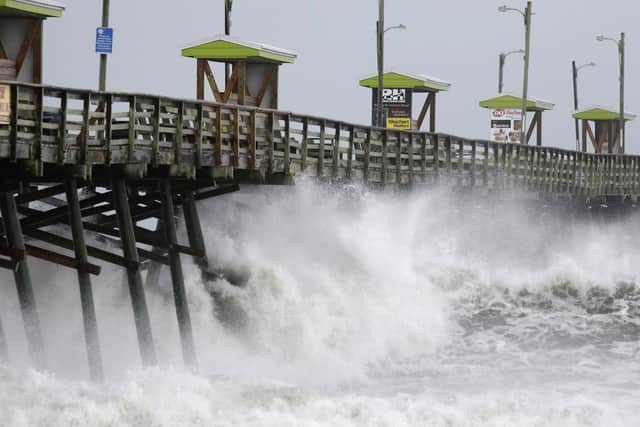 Waves from Hurricane Florence pound the Bogue Inlet Pier in Emerald Isle N.C. Picture: AP Photo/Tom Copeland