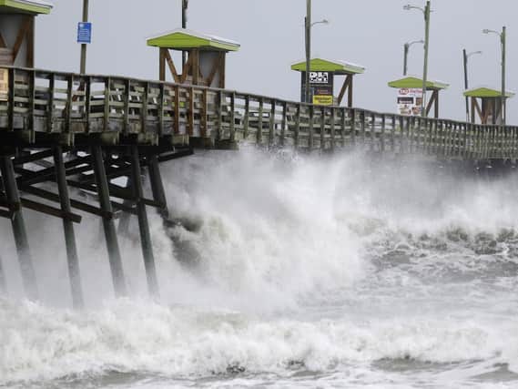 Waves from Hurricane Florence pound the Bogue Inlet Pier in Emerald Isle N.C. Picture: AP Photo/Tom Copeland