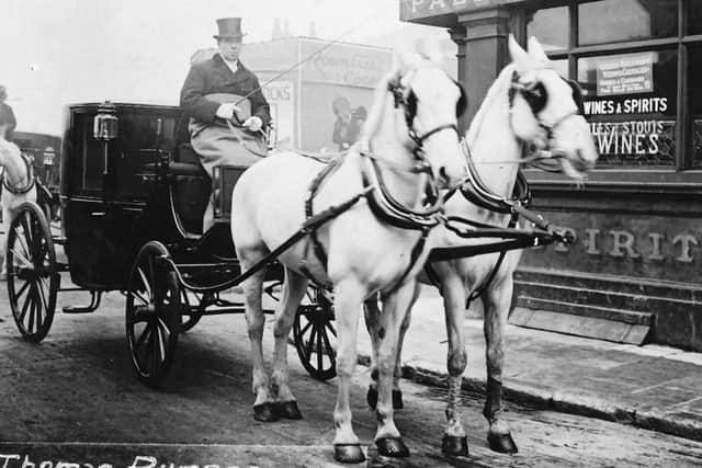 When cabs were horse-drawn. Believed to be Thomas Rumens in charge of Landau in Portsmouth. Does anyone recognise the location? Picture: Robert James collection