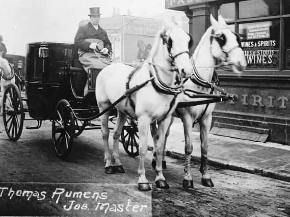 When cabs were horse-drawn. Believed to be Thomas Rumens in charge of Landau in Portsmouth. Does anyone recognise the location? Picture: Robert James collection