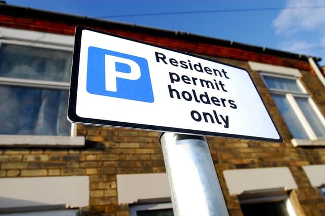 A residents' parking permit sign