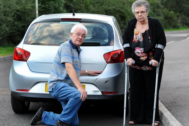 Graham and Pat White with their damaged Seat Ibiza