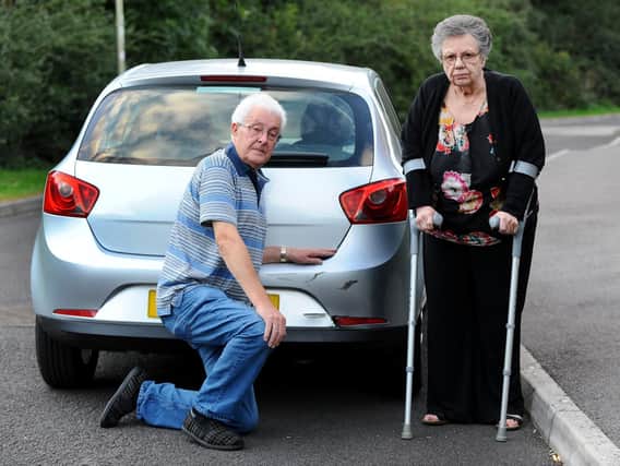 Graham and Pat White with their damaged Seat Ibiza