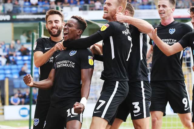 Jamal Lowe and his team mates celebrate after scoring second goal in Portsmouth's 2-1 win at Peterborough. Picture: Joe Pepler/Digital South.