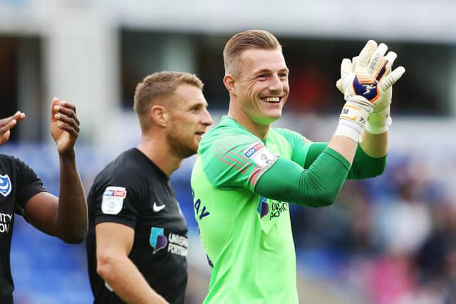 Delight at final whistle for Pompey's players after topping League One. Picture: Joe Pepler.