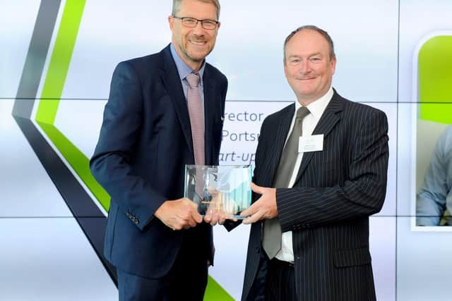 Mark Waldron, editor of The News, left, presents the 2018 Manufacturing and Construction award to 
Dunham Bush Limited managing director Mike Holding at the 2019 Breakfast Business Awards Launch