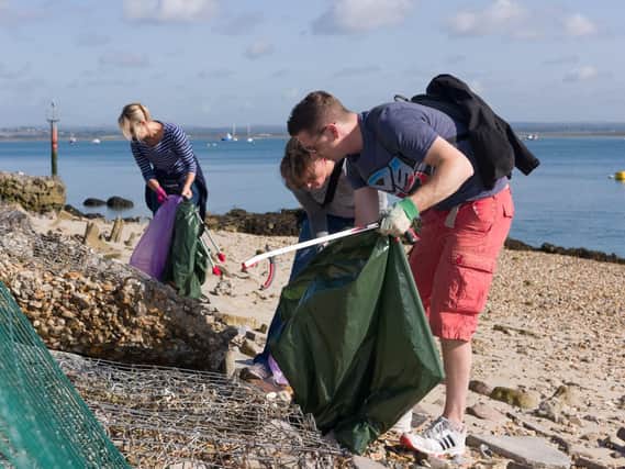 People getting stuck into the Great Solent Beach Clean close to the RNLI Portsmouth Lifeboat Station, at Ferry Road, Eastney. Picture: Duncan Shepherd