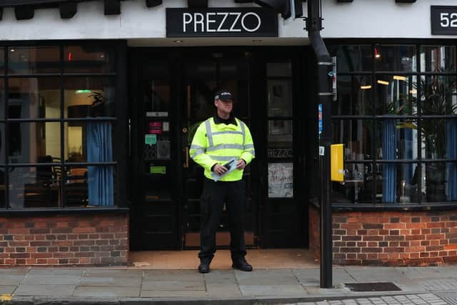 A police officer outside the Prezzo restaurant in Salisbury, where a couple had become unwell on Sunday. Picture: Jonathan Brady/PA Wire