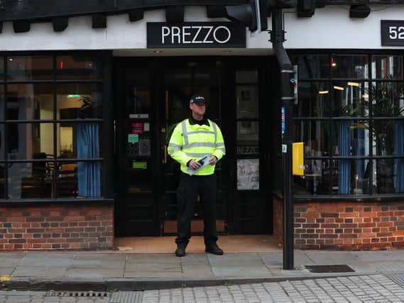A police officer outside the Prezzo restaurant in Salisbury, where a couple had become unwell on Sunday. Picture: Jonathan Brady/PA Wire
