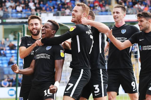 The Pompey players celebrate Jamal Lowe's goal against Peterborough on Saturday Picture: Joe Pepler