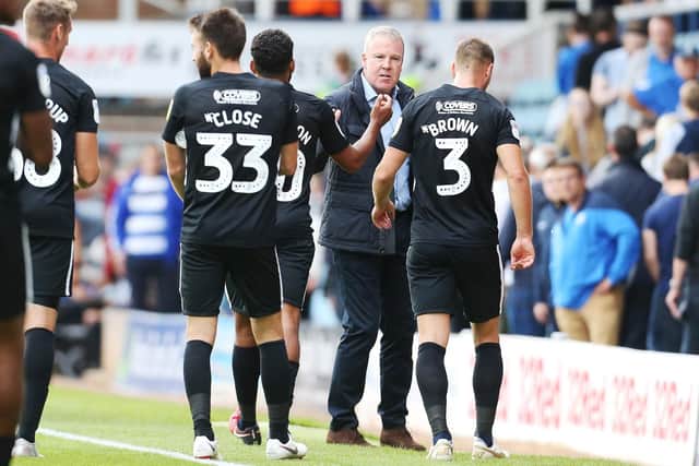 Kenny Jackett congratulates his Pompey troops after the win at Peterborough. Picture: Joe Pepler