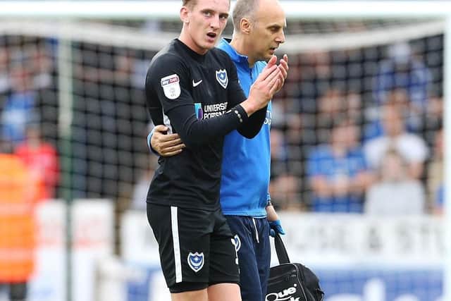Ronan Curtis applauds the Pompey fans at London Road on Saturday Picture: Joe Pepler
