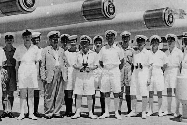 A party of officers, petty officers, ratings and Royal Marines under the guns of HMS Duke of York 1948