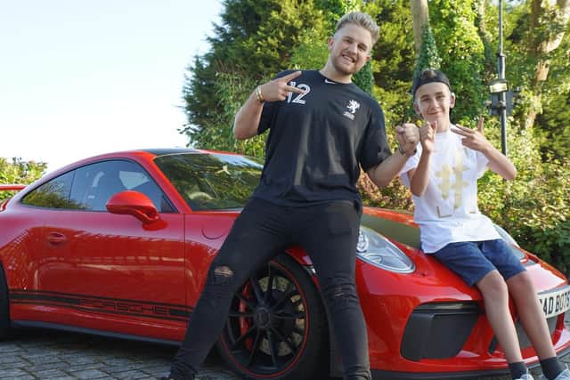 Rio Stevens hangs out with his hero Ben Phillips, who took him for a spin in his Porsche