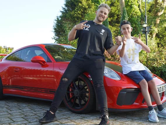 Rio Stevens hangs out with his hero Ben Phillips, who took him for a spin in his Porsche