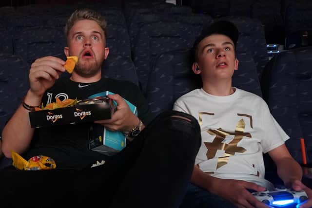 Rio and Ben play the video game fortnight in a cinema hired for the occasion