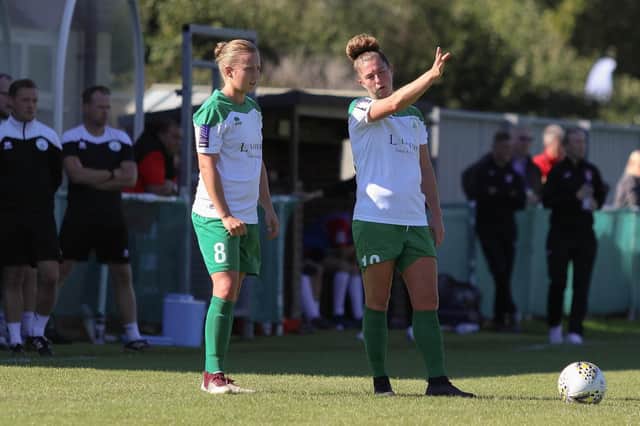 Hollie Wride, left, and Molly Clark plan a free-kick against Coventry United. Picture: Sheena Brooker