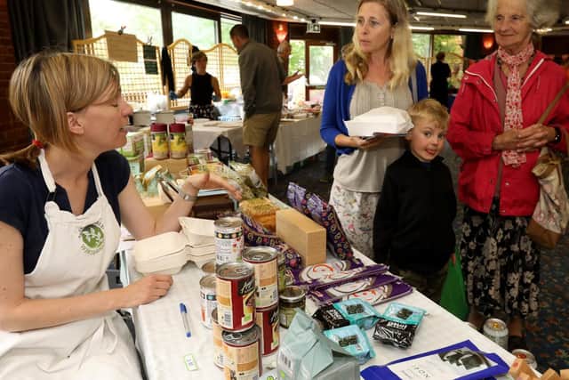 Rosie Blackburn, left, of Wild Thyme Wholefoods, Southsea, chats to Jen Hensman, Elliot, 5, and Jen's mother, Molly Cox. Gluten-free Fair at Ferneham Hall, Fareham. Picture: Chris Moorhouse