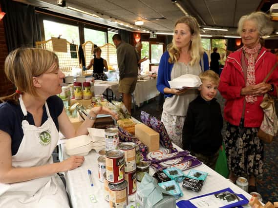 Rosie Blackburn, left, of Wild Thyme Wholefoods, Southsea, chats to Jen Hensman, Elliot, 5, and Jen's mother, Molly Cox. Gluten-free Fair at Ferneham Hall, Fareham. Picture: Chris Moorhouse