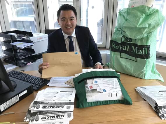 Alan Mak MP with his postbags in the House of Commons