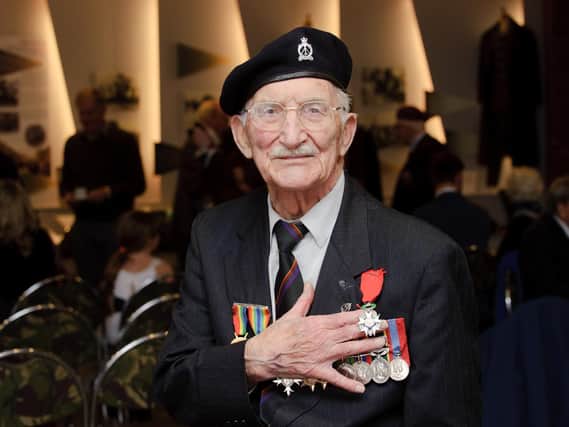 Veteran John Jenkins as he collected France's highest military honour, the Legion d'Honneur for his heroism during the D-Day landings in Normandy.
Photo: Allan Hutchings