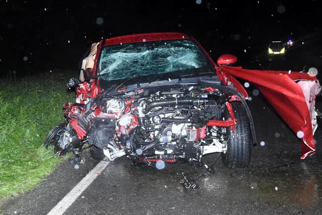 Kevin Zhou's red Jaguar F Type 4x4 after the crash on the A259. Picture: Sussex police