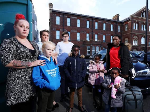 Residents of Finchdean Gardens, Milton, including Liz Sweeney, left, have not had running water for three days and have now had chemical toilets installed in the car park by their housing association Picture: Chris Moorhouse