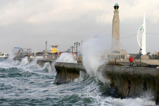 Waves crash into Southsea's sea wall - a yellow weather warning has been issued for tomorrow