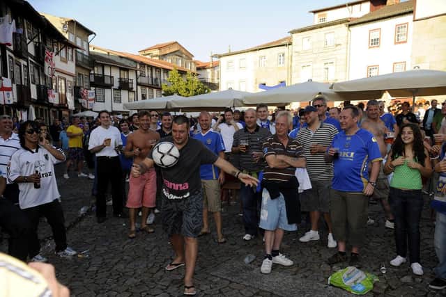 A football is introduced to the festivities in Praca de Santiago in the centre of Guimaraes hours before kick off. Picture: Steve Reid