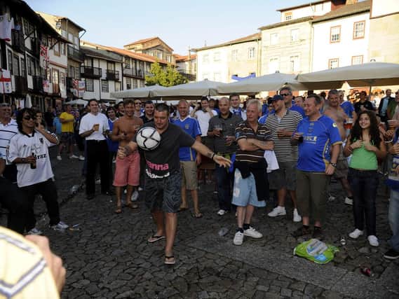A football is introduced to the festivities in Praca de Santiago in the centre of Guimaraes hours before kick off. Picture: Steve Reid