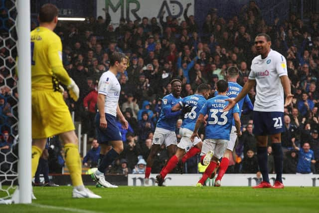 Gareth Evans celebrates after levelling for Pompey with a header. Picture: Joe Pepler