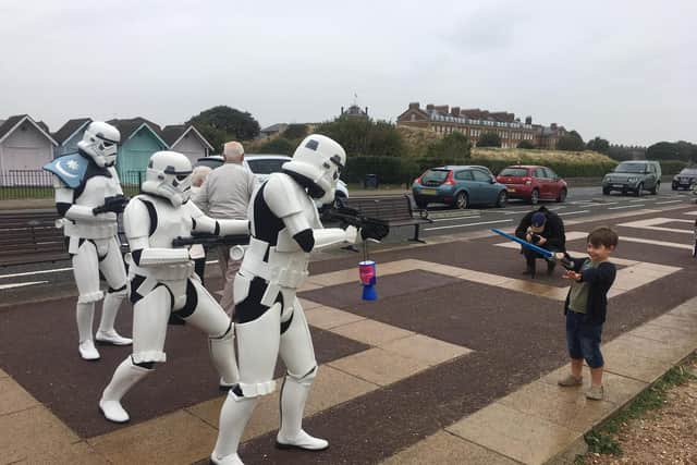 Harry Crackle, five, battles against three of the Stormtroopers. Photo: Tom Cotterill