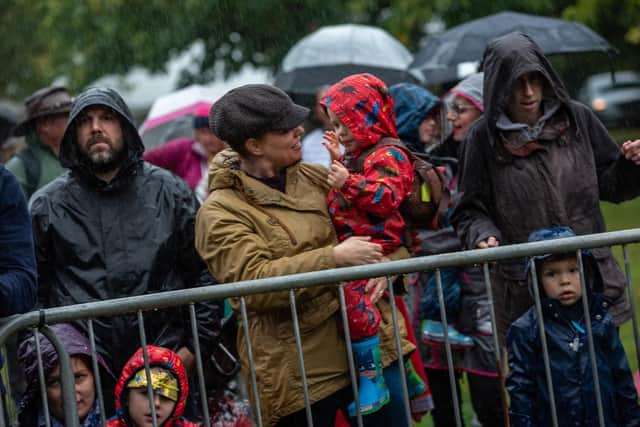 Umbrellas and raincoats all round at the Charmed Life Festival in Victoria Park in Portsmouth Picture: Vernon Nash (180434-052)