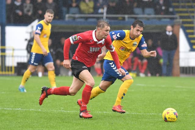 Gosport Borough's Connor Hoare tries to keep Ramsgate at bay. Picture: Neil Marshall